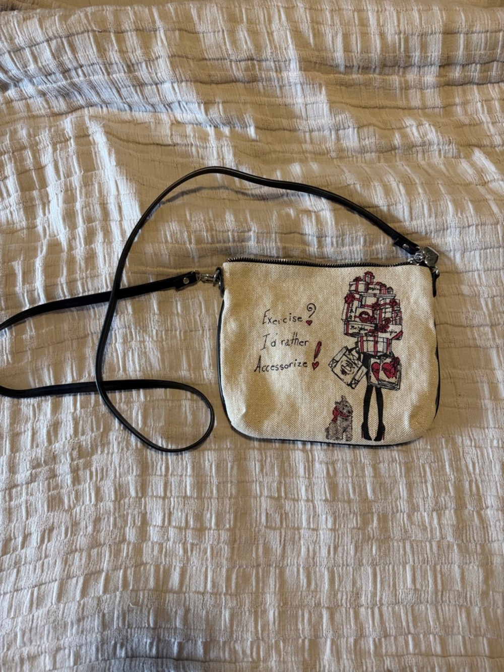 Brighton Cream Canvas Crossbody with Black Trim and Red Accent Illustration